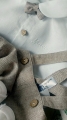 Baptism set for a boy in a beige herringbone pattern, shorts with suspenders and buttons, and a bow tie.jpg