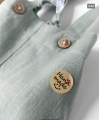 green linen baptism shorts with suspenders for a one-year-old boy (2).jpg